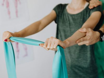 Woman hands holding a stretching band
